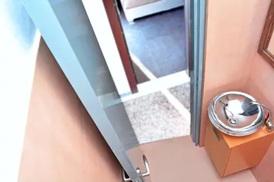 an open glass door with a dog inside of it at Athens Connection Apartments in Athens