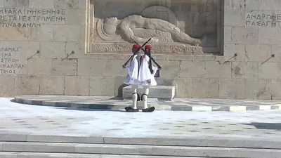 a statue of a woman standing in front of a monument at Acropolis Suite in Athens