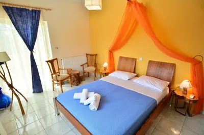 a bedroom with a bed with two towels on it at Villa Filoxenia all seasons, near airport, sea, Athens in Aghia Marina