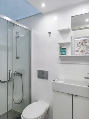 a bathroom with a toilet and a shower and a sink at KYMA Apartments - Athens Acropolis 2 in Athens