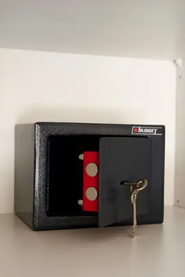 a small radio with a key in front of it at Boutique52 Luxury Apartments in Athens