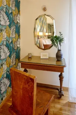 a mirror on top of a table in a room at Rastoni Athens Suites near Acropolis in Athens