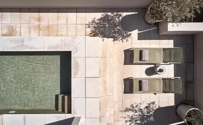 an overhead view of a building with a swimming pool at Grystal Green Properites in Athens