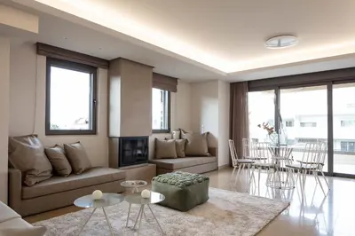 a living room with a couch and a table at Grystal Green Properites in Athens