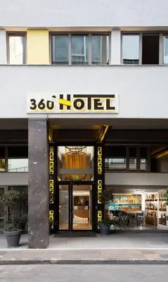 a building with a sign for a motel at 360Degrees Pop Art Hotel in Athens