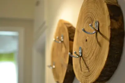 a wooden object is hanging on a wall at Biophylic - 3bdr apartment in Athens