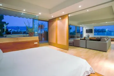 a bedroom with a bed and a couch in a room at 5* 
