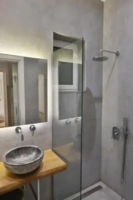 a bathroom with a sink and a shower at Luxury Apartment near Acropolis in Athens