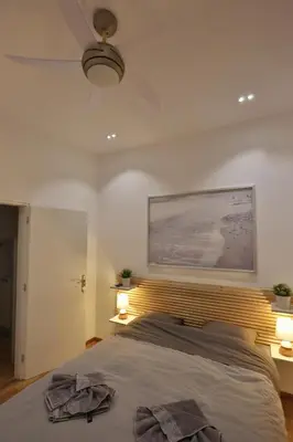 a bedroom with a bed with two towels on it at Luxury Apartment near Acropolis in Athens