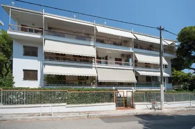 an apartment building with white balconies on a street at Starapartment Athens-Varkiza Top 2 in Varkiza