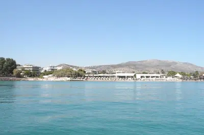 a view of the water with a town in the background at Starapartment Athens-Varkiza Top 2 in Varkiza