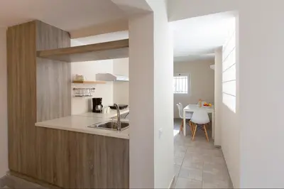 a kitchen with a sink and a counter at Psirri Place economy apartments centrally located in Athens