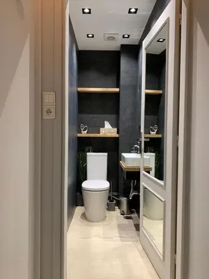 a bathroom with a toilet and a sink at Central Apartment in Athens