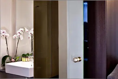 a bathroom with a sink and a mirror at Acropolis Hill Hotel in Athens