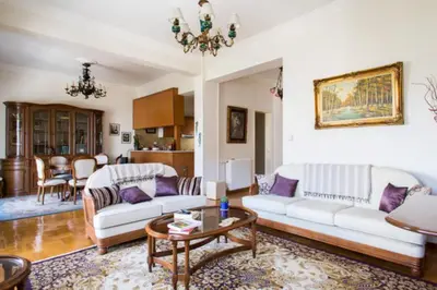 a living room with two white couches and a table at Large 3 bedroom Apt with Terrace in Athens