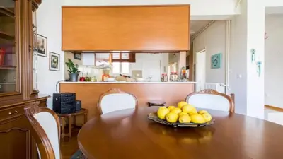 a dining room table with a bowl of fruit on it at Large 3 bedroom Apt with Terrace in Athens