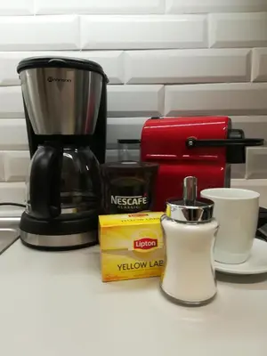 a coffee maker and other items on a counter at Olympus Residence in Athens