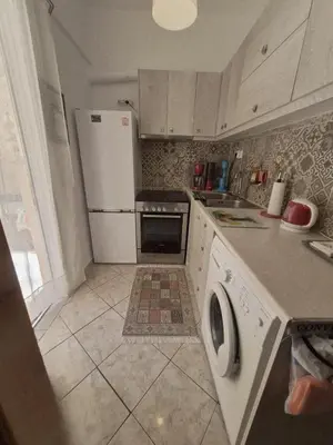 a kitchen with a white refrigerator and a dishwasher at •Budget travellers •Great location in Athens