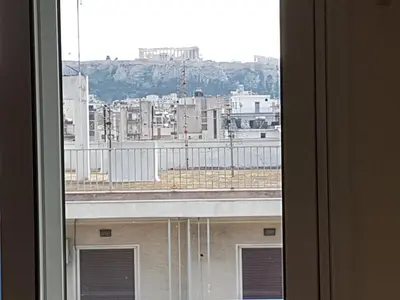 a view of a city from a window at Apollo Hotel in Athens