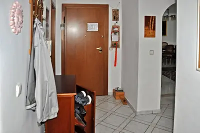 a room with a hallway with a door and a room with a hallway at Seaside Apartment 157 м2 in Athens