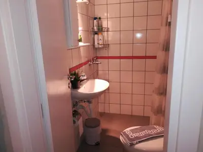 a small bathroom with a sink and a toilet at Koukaki ideal studio for 2 in Athens