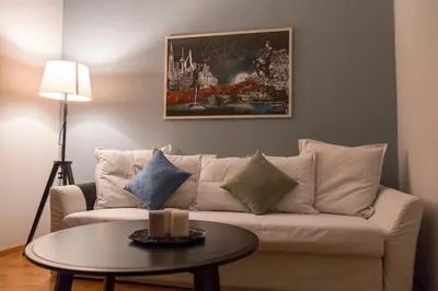 a living room with a couch and a table at Gazi Discrit Next To Subway in Athens