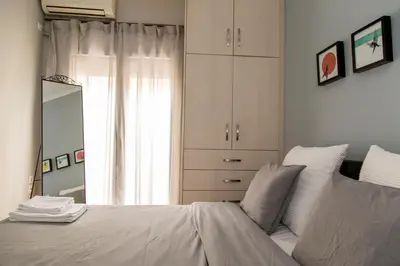 a bedroom with a white bed and a window at Gazi Discrit Next To Subway in Athens