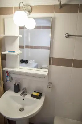 a bathroom with a sink and a mirror at Gazi Discrit Next To Subway in Athens