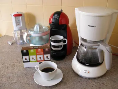 a blender and a cup of coffee on a counter at ELITE apartment 5 min to Acropolis in Athens