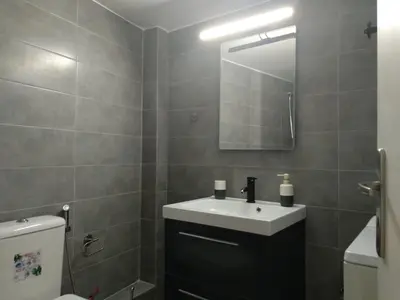 a bathroom with a sink and a toilet and a mirror at ELITE apartment 5 min to Acropolis in Athens