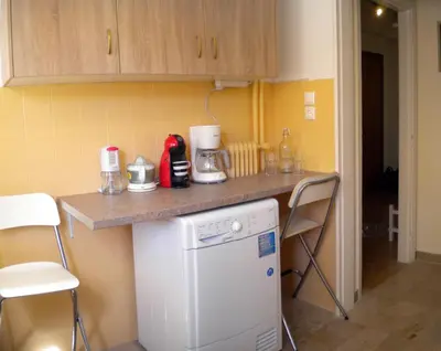 a small kitchen with a counter and a dishwasher at ELITE apartment 5 min to Acropolis in Athens