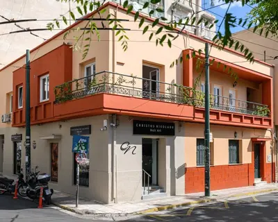 a building on the corner of a street at Circle Inn in Athens