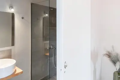 a bathroom with a shower and a sink at Circle Inn in Athens