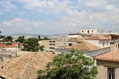 a view of roofs of buildings in a city at Nefeli Hotel in Athens