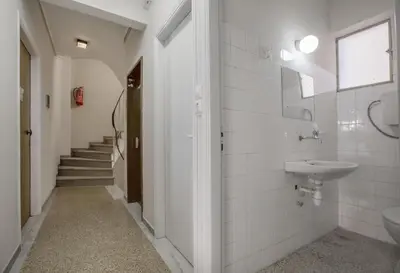 a bathroom with a sink and a toilet at Leonidas Loft in the heart of Athens by GHH in Athens