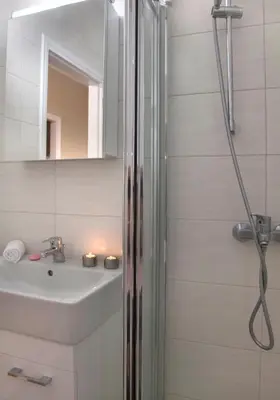 a bathroom with a shower and a sink at Leonidas Loft in the heart of Athens by GHH in Athens