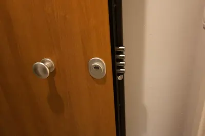 a wooden door with a door knob on it at Dynasta Central Suites in Athens