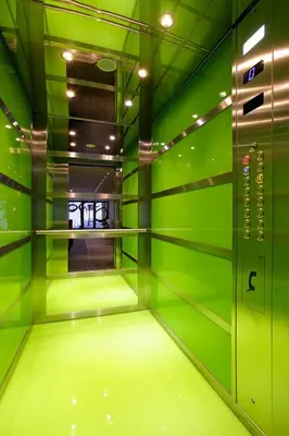 an empty room with green walls and a neon green floor at Athens Mosaico Suites & Apartments in Athens