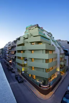 a large apartment building on the side of a street at Athens Mosaico Suites & Apartments in Athens