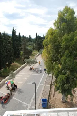 a view of a parking lot with people in it at Acropolis At Your Door in Athens