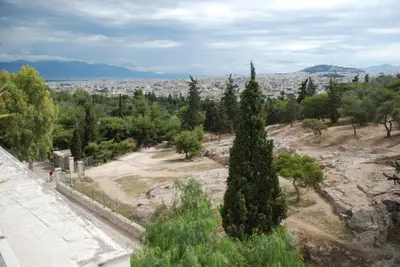a view of a park with trees and a city at Acropolis At Your Door in Athens