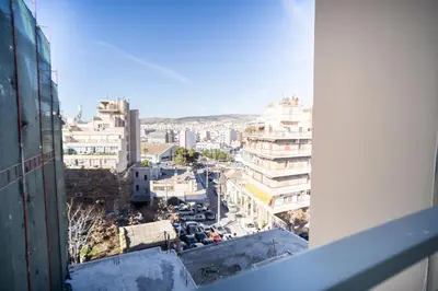 a view of a city from a building at Eva Hotel Piraeus in Piraeus