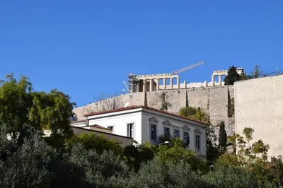a white house sitting on top of a wall at Absolute Athens II in Athens