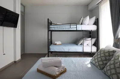 a bedroom with two bunk beds with towels at Alpha Residence in Athens