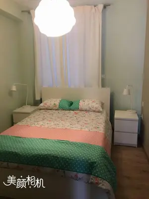 a bedroom with a bed and a light at Athens Plaka Modern Decorated Apartment in Athens