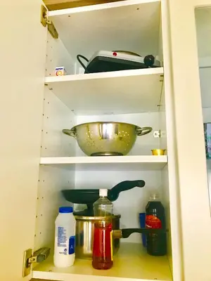 a kitchen shelf with a bowl and other items at Athens Plaka Modern Decorated Apartment in Athens
