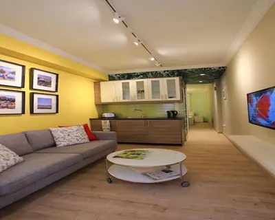 a living room with a couch and a table at Athens Plaka Modern Decorated Apartment in Athens