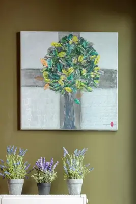 a painting of a tree on a wall with potted plants at Armoniko in Athens