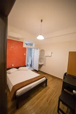 a hospital room with a bed and a bathroom at Tempi Hotel in Athens