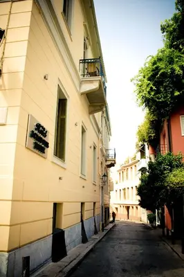 an empty street in front of a building at Acropolis House Hotel Classic in Athens